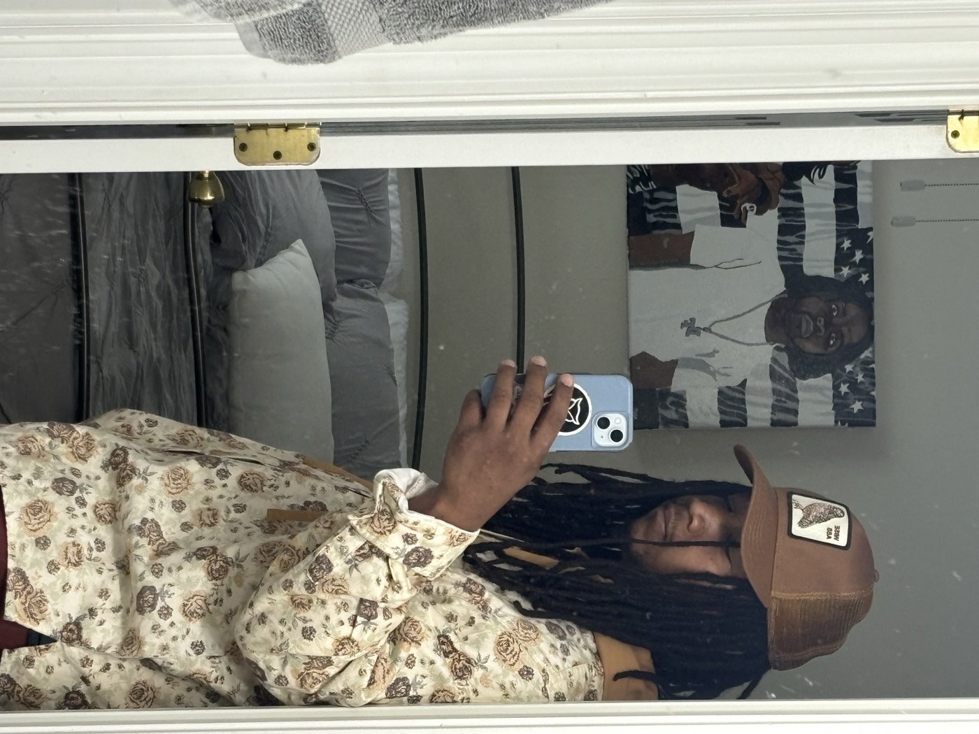 Sl1ck N°1 mirror selfie in a floral shirt
